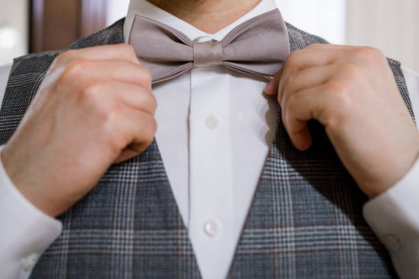 istock a man puts on a bow tie with his hands 1277721234