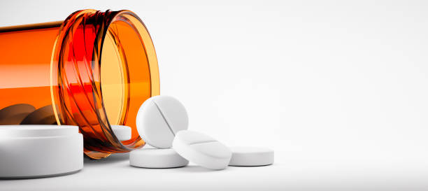 белые таблетки с оранжевой бутылкой - pill bottle bottle medicine white стоковые фото и изображения