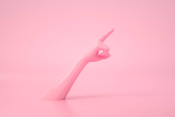 istock Female Hand Pointing Up, Pink Color Background 1277723599