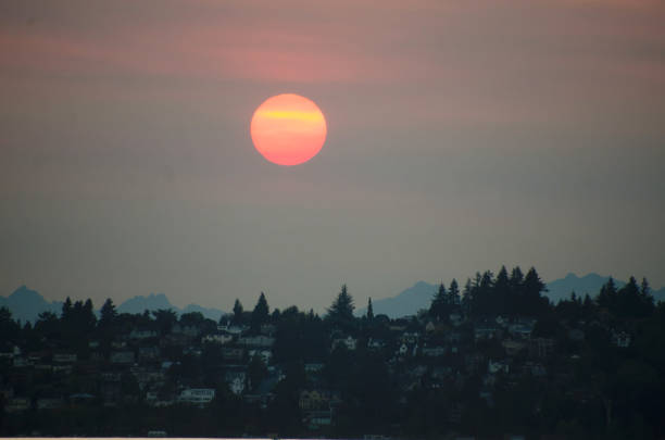 Red Sunset over Northeast Seattle and lake Washington, during forest fire season stock photo