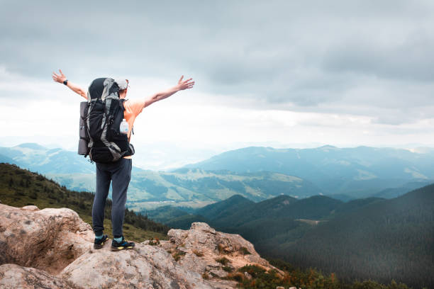 istock young hiker man in mountains. summer trekking path 1277726480