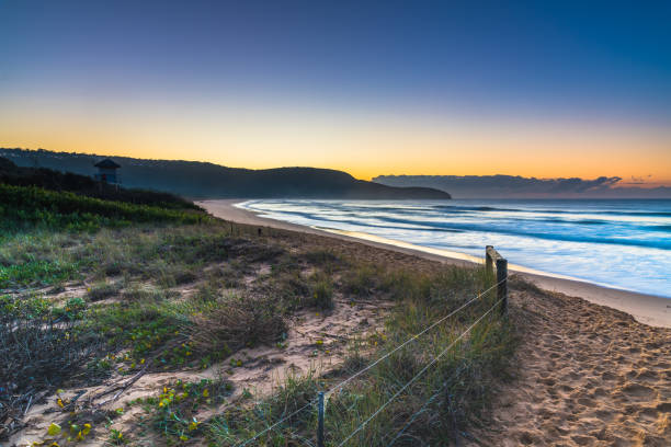istock Clear skies and sunrise at the beach 1277727309