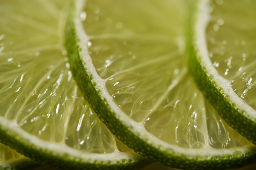 Lime slices as pattern isolated on white background