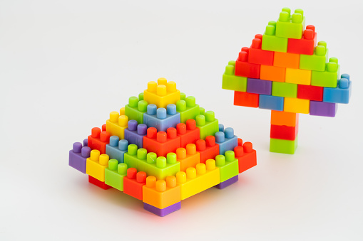 The pagoda and pine trees are built with rainbow toy bricks. Children's educational toys