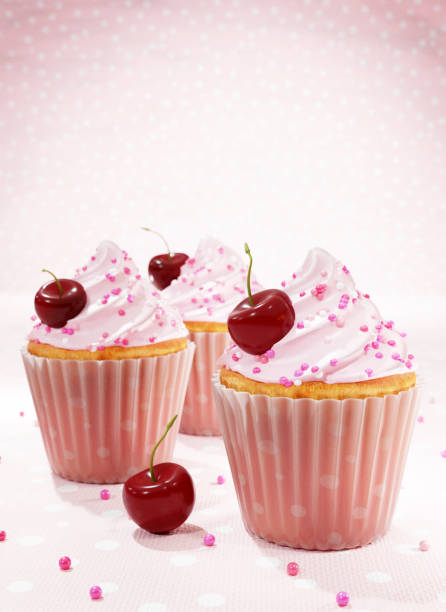 istock 3D illustration of Appetizing  cupcakes with swirled icing sugar and cherries. 1277729569
