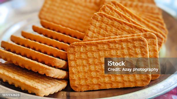 Wheat Biscuits In The Steel Plate With Blury Background Indian Biscuits Popularly Known As Chaibiscuit In India Stock Photo - Download Image Now