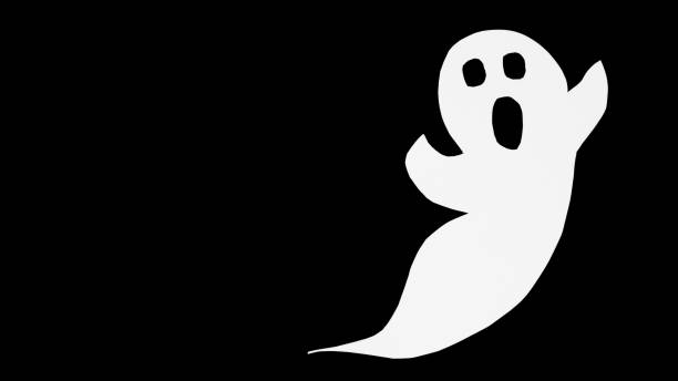 istock Cut out paper ghost on black background. Halloween background decor holiday concept. 1277736938