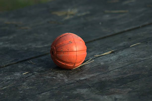 istock orange ball on a wooden table top 1277739588