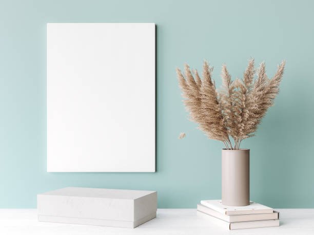 Interior frame mockup with vertical white wooden canvas on green wall decorated Interior frame mockup with vertical white wooden canvas on green wall decorated with dried pampas beige vase. A4, A3 size. pampas photos stock pictures, royalty-free photos & images