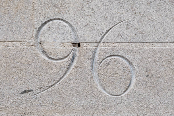 istock Number ninety six carved into stone wall background 1277741273