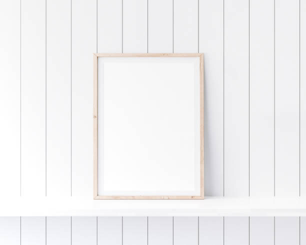 Mockup poster frame close up in coastal style interior on white shelf. Mockup poster frame close up in coastal style interior on white shelf. farmhouse photos stock pictures, royalty-free photos & images