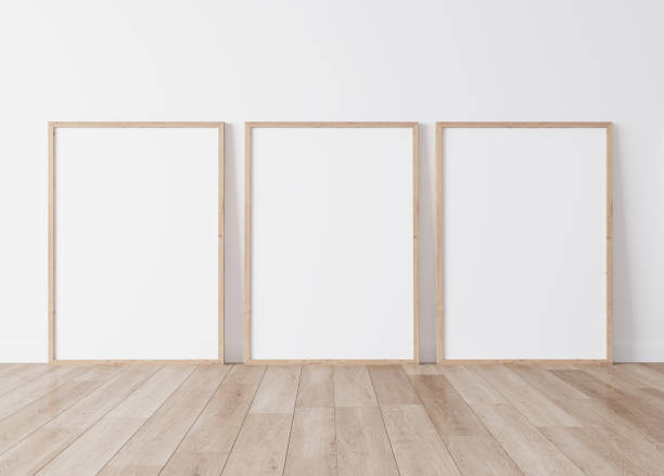 Three vertical wooden frames standing on parquet floor with white background, minimal frame mock up interior Three vertical wooden frames standing on parquet floor with white background, minimal frame mock up interior, 3d render three objects photos stock pictures, royalty-free photos & images