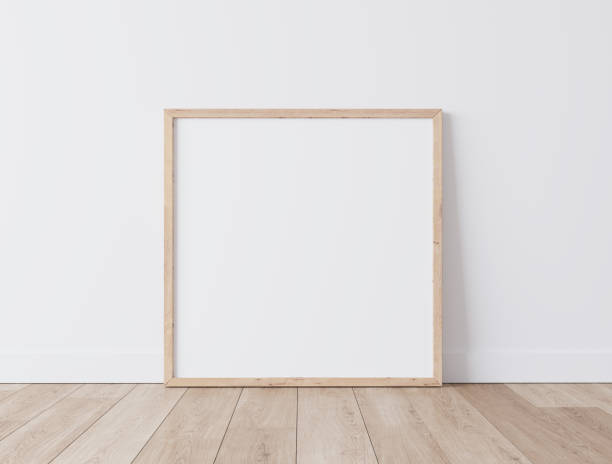istock Wooden square frame Standing on parquet floor with white background, minimal frame mock up interior 1277741569