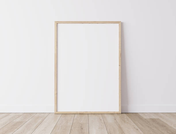 istock Vertical wooden frame Standing on parquet floor with white background, minimal frame mock up interior 1277741696