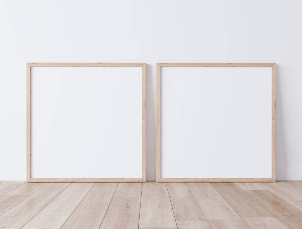 istock Two wooden square frames Standing on parquet floor with white background, minimal frame mock up interior 1277742464