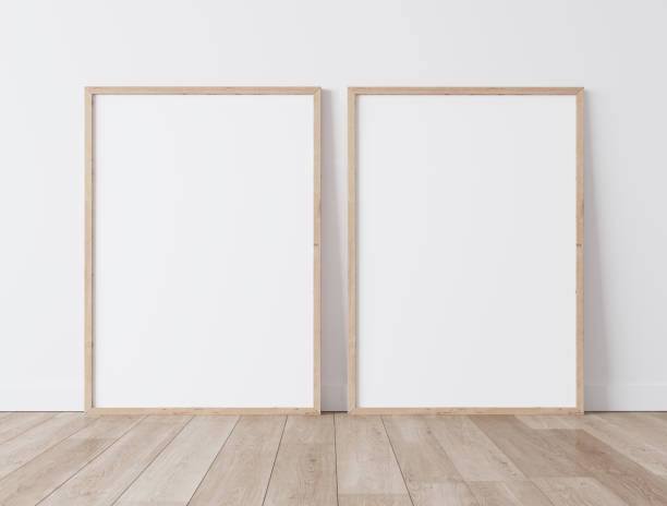 Two vertical wooden frames Standing on parquet floor with white background, minimal frame mock up interior