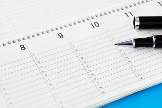 istock Calendar with pen and blue background 1277743455