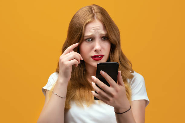 istock Young woman in white t shirt using smartphone. New useful application 1277744368