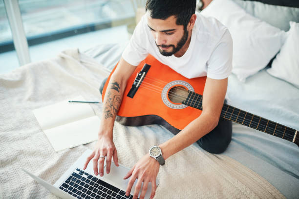 istock I'm taking virtual lessons to learn more about playing the guitar 1277745971