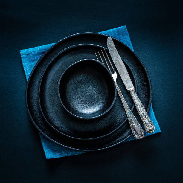 istock Black place setting shot from above on dark table 1277746008