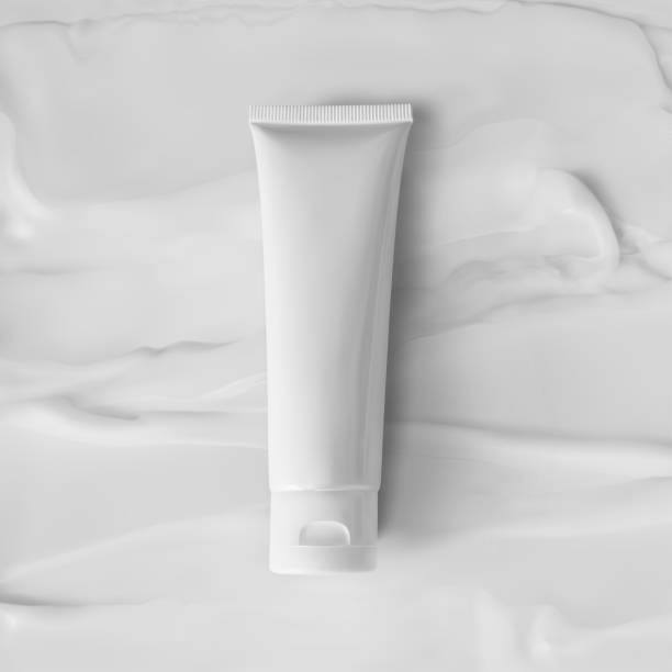 istock Tube cream mockup on texture of smear creamy moisture background vector realistic illustration, above. Blank cosmetic pack of cosmetic products 1277746497