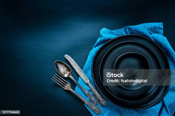 Black Place Setting Shot From Above On Dark Table Stock Photo - Download Image Now - Place Setting, Backgrounds, Black Color