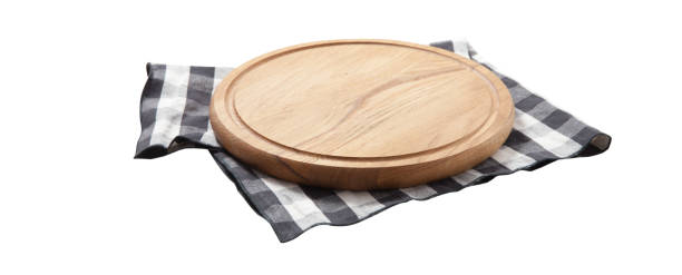 istock Empty pizza board and tablecloth on wooden deck table with napkin 1277750753
