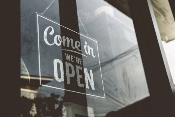 istock Come in we're open, vintage retro sign in cafe front 1277753920