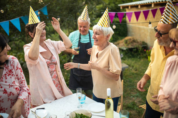 istock Old friends having fun time on birthday party at backyard 1277753953
