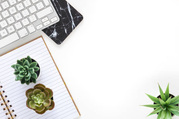 istock White desk in the office. View from above. 1277756030
