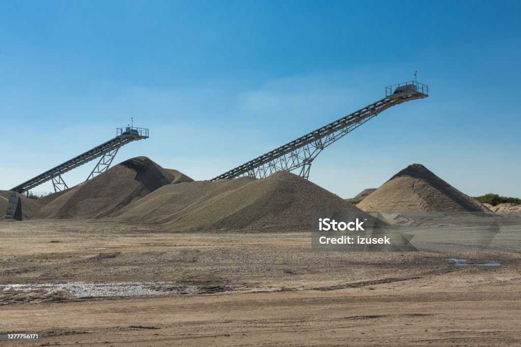 Open-pit mining Conveyor belts in open-pit mining. No people. Conveyor Belt Stock Photo