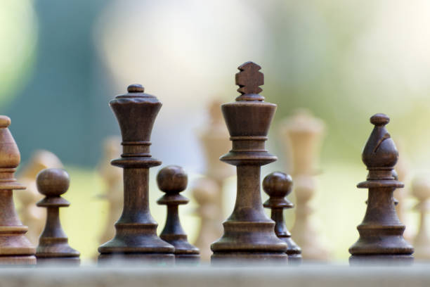 istock Chess Pieces standing on the Chessboard before the tournament. 1277761097