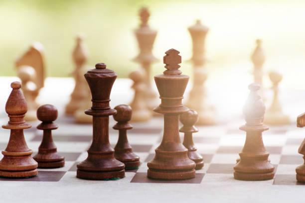 istock Chess Pieces standing on the Chessboard before the tournament. 1277761101