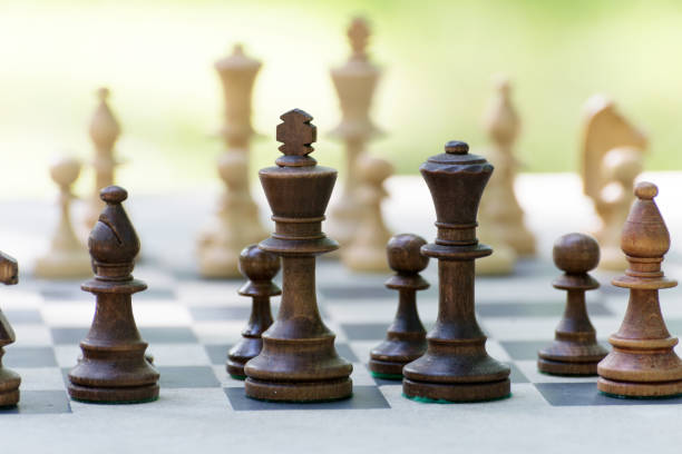istock Wooden Chess Pieces standing on the Chessboard before tournament. 1277761112