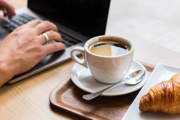 istock Freelancer sitting in cafe, drinking coffee and using a laptop 1277761712