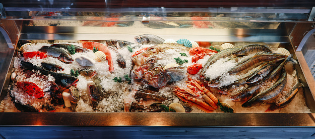Frozen fish assortment ready to be cooked in a seafood restaurant.