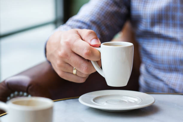 istock Businessman sitting in cafe, drinking morning coffee and using smartphone 1277762356