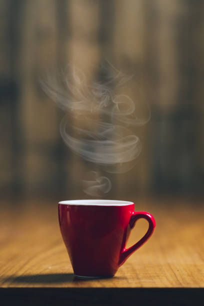 istock Red espresso cup with coffee on wooden table 1277762996