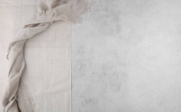 istock Pure washed linen cloth on light grunge stone background. 1277763501