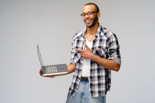 istock A young african american man working with a laptop pc 1277764800