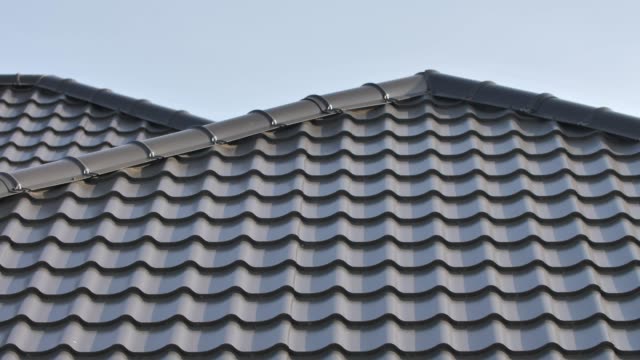 Modern Corrugated Metal Roofing. Roof Made of Metal Tiles Close Up