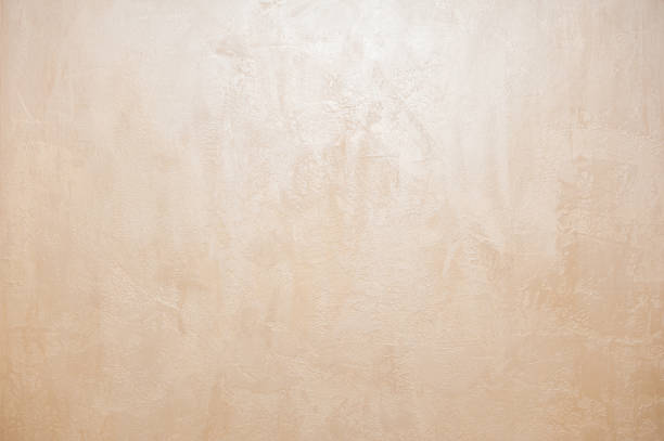 Wall decor Venetian decorative plaster with glitter paint. Background, abstraction. Apartment renovation concept.