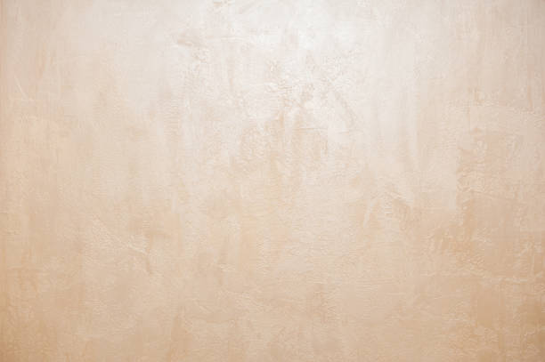wall decor venetian decorative plaster with golden glitter paint. background, abstraction. apartment renovation concept. copy space - plaster imagens e fotografias de stock