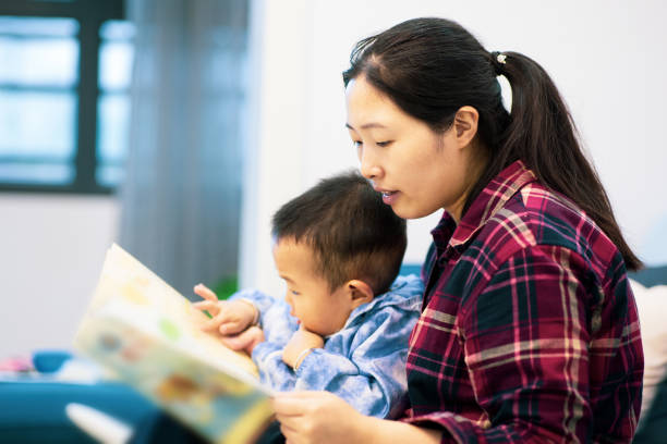istock Mom and son reading a picture book 1277765934