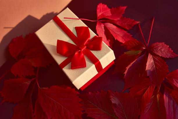 istock Christmas box with red ribbon 1277766173