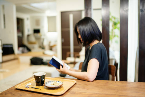 istock Woman preparing a cup of tea in a domestic kitchen 1277770041