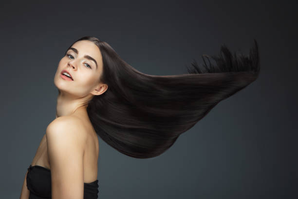 istock Beautiful model with long smooth, flying brunette hair 1277774021