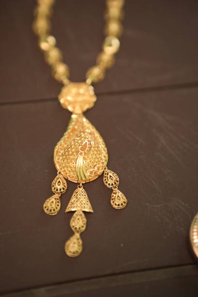 istock gold chain placed on a brown background 1277775321