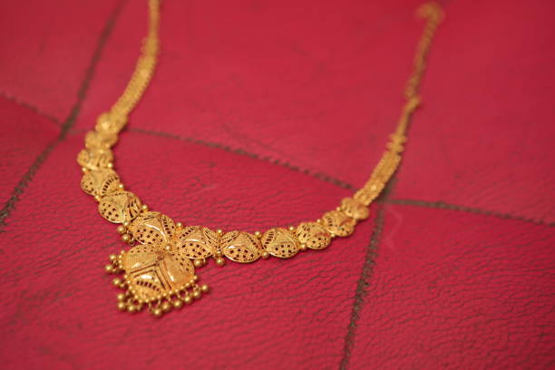 istock gold chain placed on a red background 1277775910