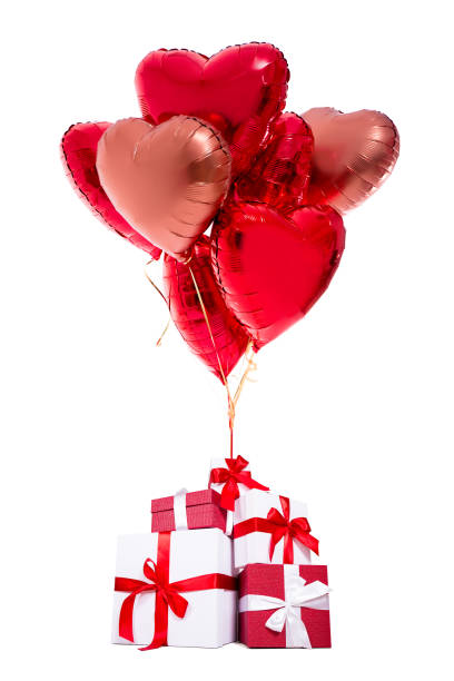 istock valentine's day or birthday concept - gift boxes with red balloons isolated on white 1277777981